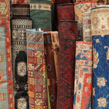 Tips for layering an area rug over carpet